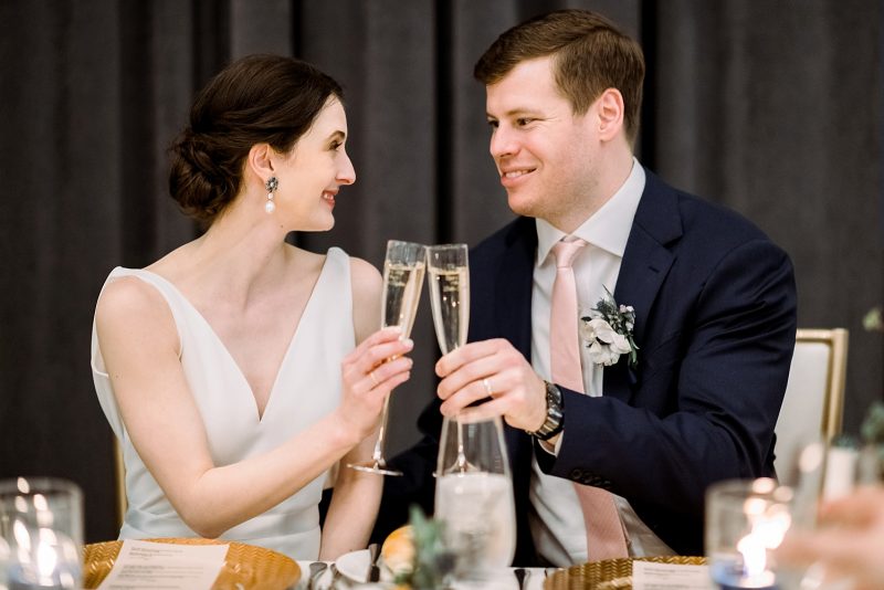 Bride and groom toasting with champagne flutes
