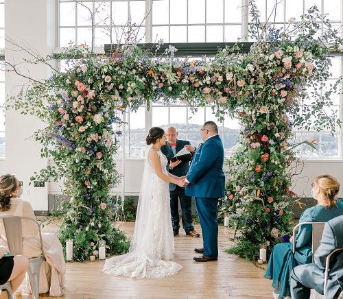 Floral Filled Energy Innovation Center Microwedding. For more small wedding ideas, visit burghbrides.com!